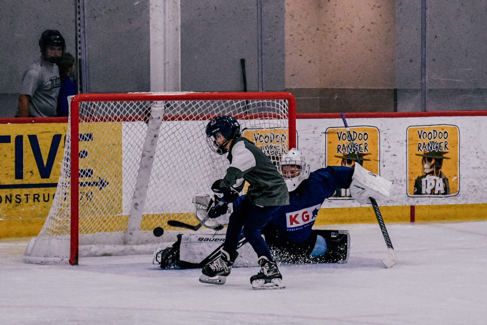 Goalies working through a drill at a KG camp