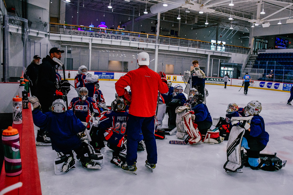 Goalie drill in progress at a KG summer camp