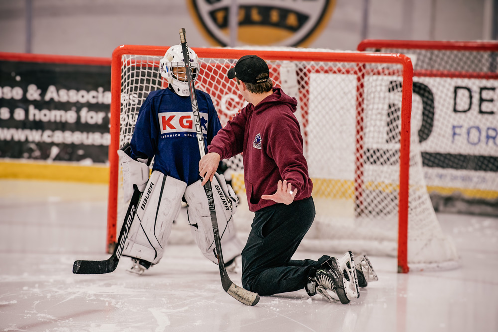 Camp goalies lined up for a skating drill