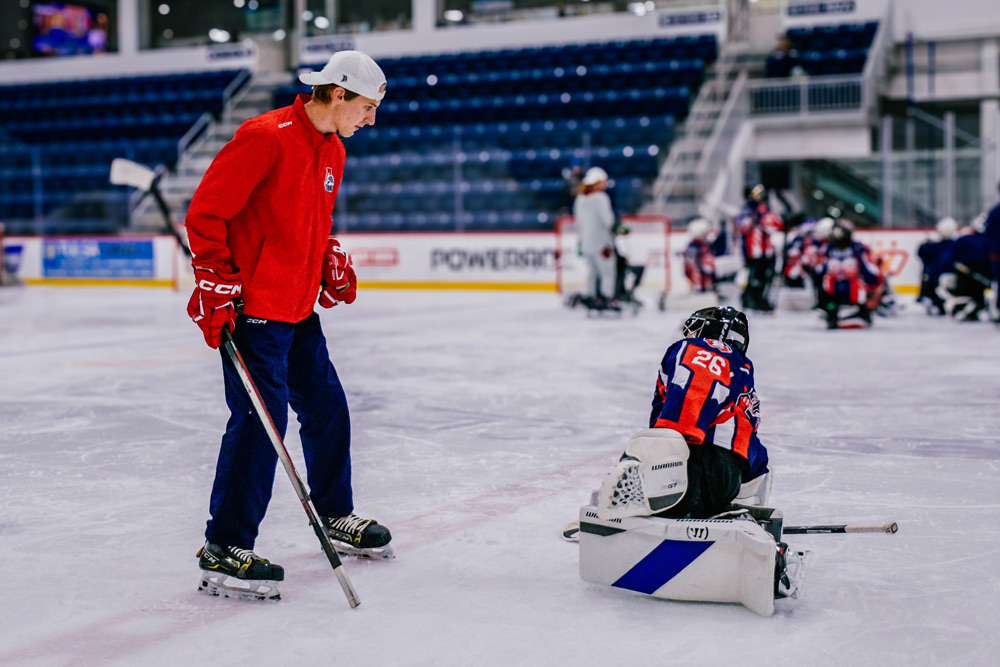 Julian Zvyagin, second-generation goaltending coach, working with goalies on the ice